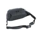 The Tatonka Medium Funny Bag is a sleek black, rectangular crossbody bag featuring an adjustable hip belt and a zipper closure.
