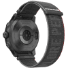 Rear perspective of a black Coros Apex 2 Pro GPS Outdoor Watch showcasing a fabric wristband and multiple sensors, including a heart rate sensor, on the case.