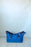 The Blue Tag Equipment Magic Carpet Rope Bag features blue fabric with black accents, blue straps, and two front buckles—ideal for carrying climbing gear or rope protection on your next Grampians adventure.