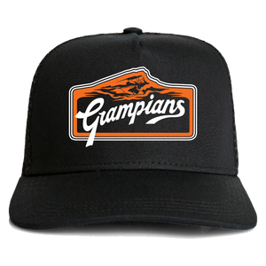 Black baseball cap with an orange and white "Absolute Outdoors Frontier Truckers Cap" logo featuring a mountain silhouette by Machine Printers.