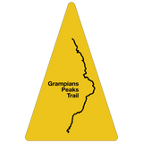 Map outline of the Absolute Outdoors GPT Route Map Trail Marker Woven Patch on a yellow triangular background.
