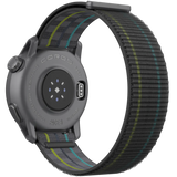 Rear view of a black Coros Pace 3 GPS Sport Watch with a grey and yellow striped nylon strap, showcasing advanced technology such as its charging port and sensor array.