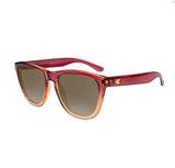 Knockaround Premium Sunglasses by Knockaround feature a gradient red and orange frame with tinted, impact-resistant lenses and a logo displayed on the temple.