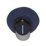 The Sunday Afternoons Adventure Stow Hat, featuring sun protection, is a navy blue bucket hat with a wide brim and a gray bill, beautifully showcased from above on a white background.
