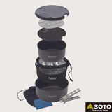 Stacked Soto Navigator Camping Cookware Set components—pots, lids, mesh bags, grill, pot gripper, and cleaning sponge—showcase versatile outdoor cooking essentials. The Soto logo is displayed in the bottom right corner.