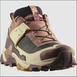 Close-up of the Salomon X Ultra 5 Women's Hiking Shoe featuring a pink, cream, and black design with a durable Contagrip sole and lace-up style, ideal for outdoor adventures.