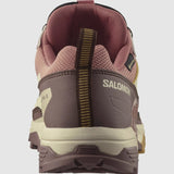 Back view of a Salomon X Ultra 5 Women's Hiking Shoe in pink and brown with Gore-Tex, featuring a Contagrip sole and heel tab.