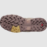 The Salomon X Ultra 5 Women's Hiking Shoe features a brown and beige sole with geometric studs for traction and Contagrip technology for superior grip on any terrain.