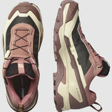 Two Salomon X Ultra 5 Women's Hiking Shoes in pink, beige, and black are shown: one from the top and the other from the side, highlighting the brand name and detailed stitching. The Matryx® fabric integration ensures durability and style on rugged trails.