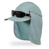 A light blue Sunday Afternoons Vaporlite Cape Cap sun hat with a neck flap, made from recycled fabric, plus a pair of black sunglasses resting on the brim.