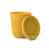 The Sea to Summit Passage Cup in yellow is made from food-grade polypropylene, featuring a matching removable lid, ribbed texture, and simple embossed logo. Compact and stackable, it’s ideal for daily use.