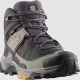 The Salomon X Ultra 5 Women's Hiking MID by Salomon is a gray and black boot with yellow accents, rugged Contagrip tread, mesh fabric, and supportive ankle padding—your perfect hiking companion for any trail.