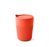 The Sea to Summit Passage Insulated Mug is a reusable, red, ribbed camping mug with a matching lid, made from food-grade polypropylene by Sea to Summit, displayed on a plain white background.