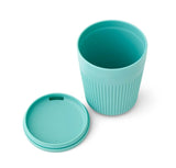 The Sea to Summit Passage Insulated Mug is a turquoise, stackable camping mug made from food-grade polypropylene with a textured grip and matching removable lid, displayed on a white background.