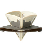 A Sea to Summit Frontier Ultralight Collapsible Pour Over mounted on a reflective stainless steel surface.