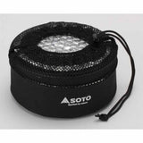 The Soto Navigator Camping Cookware Set comes in a black mesh drawstring bag with "SOTO" and "Sparked by nature" printed on the side, perfect for your camping cookware set or essential outdoor cooking gear.