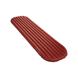The Vaude Performance Winter 7M Sleeping Mat, a lightweight red inflatable sleeping pad with vertical air chambers, is ideal for mountain climbers. Displayed on a white background.