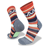 The Wilderness Wear Merino Fusion Light Socks feature a multicolored design with orange, navy, white, and gray stripes and geometric patterns, plus a Secure Fit System. Shown from side and bottom angles.