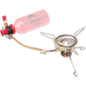 Portable camping stove with a red control valve and an attached pink fuel bottle, set on a white background. Ideal for backpackers. MSR - Whisperlight International Multi Fuel Stove.