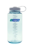 A translucent Nalgene Sustain Wide Mouth Bottle 1000ML with measurement markings and a gray screw-on cap, filled partially with water, isolated on a white background.