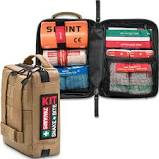 The Survival Snake Bite First Aid Kit by Survival First Aid is displayed with its open bag revealing bandages, a splint, and a smart bandage specifically designed for snake bite first aid, among other essential emergency supplies. The brown exterior features a "KIT" label, emphasizing its durable and compact design.