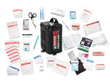 The Survival First Aid Kit by Survival First Aid is a comprehensive travel kit with tools and medical supplies like SMART Bandages, scissors, and a CPR chart, all organized in a black survival bag.