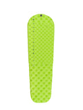 The bright green, inflatable Sea to Summit Comfort Light Air Sprung Mat features a quilted pattern and Air Sprung Cells. It includes a multi-function high flow-rate valve and is labeled "Sea to Summit" along the side.