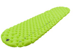 A green Sea to Summit Comfort Light Air Sprung Mat with a quilted texture and rounded edges, designed for camping or outdoor use. The pad features Air Sprung Cells and a multi-function high flow-rate valve for efficient inflation and deflation.