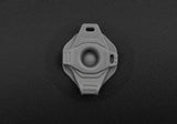 A Sea to Summit Aeros Ultralight Pillow key ring on a black surface.