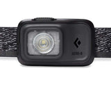 Front view of the Black Diamond Astro 300 Rechargeable Headlamp showcasing a central LED light. The front displays the Black Diamond logo and the label "ASTRO-R" along with an adjustable patterned strap, offering 300 lumens of brightness.