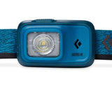 The Black Diamond Astro 300 Rechargeable Headlamp is a blue headlamp with the brand logo and the text "Astro-R" on the front, featuring an adjustable strap and a central LED light that provides 300 lumens of brightness.
