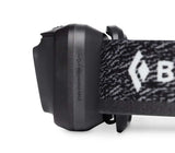 A close-up side view of the Black Diamond Astro 300 Rechargeable Headlamp, showcasing its patterned headband and a USB symbol indicating charging capability. The headlamp delivers a powerful 300 lumens for excellent visibility.