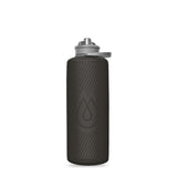 The HydraPak Flux Bottle 1L, a black reusable bottle with a textured surface, water drop logo, and spill-proof twist cap, is shown against a white background.