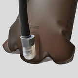 Close-up of the HydraPak Force Bladder, a brown hydration bladder featuring a black insulated tube and clear plastic high-flow mouthpiece, shown on a plain light background.