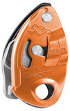 A close-up view of an orange and silver Petzl Gri Gri belay device, created by Petzl for use with single ropes and featuring assisted braking for rock climbing.