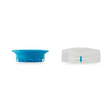 Two components of a bottle cap lie side by side: a blue bottom piece with grooves and a translucent top piece with a blue indicator, characteristic of our Hydrapak Recon 750ml Bottle by Hydrapak.
