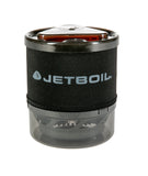 A compact Jetboil cooking stove in black and transparent with a neoprene cover featuring the brand logo. The Jetboil MiniMo Cooking Stove efficiently heats with advanced FluxRing technology.