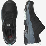 A pair of black and gray Salomon X Ultra Women's GTX hiking shoes with OrthoLite insoles and women-specific stability.