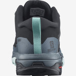A rear view of a gray Salomon X Ultra Women's GTX Hiking Shoe with teal accents and branding details on the heel.