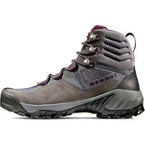 A gray hiking boot with a black treaded Vibram® sole, dark red accents, and the brand "Mammut" on the side. Perfect for hiking, this Mammut Women's Sapuen High GTX Hiking Boot features a durable construction to keep your feet comfortable and supported on the trails.