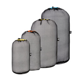 Four Sea to Summit Mesh Stuff Sacks on a white background.