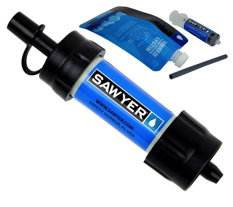 A Sawyer Mini Water Filtration System with a syringe, cleaning plunger, and a water pouch for backcountry water purification.