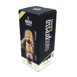 The vibrant yellow packaging of the Wacaco Nanopresso features an elegant image of this portable espresso maker, paired with a steaming coffee cup, emphasizing its sleek and compact design by Wacaco.