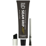 A tube of Gear Aid Seam Grip Waterproof Sealant & Adhesive with a brush applicator and a separate cleaning tool.