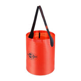 A bright orange, cylindrical Sea to Summit Folding Bucket with a black handle made from food grade coated fabric for safe use. This lightweight water storage option ensures easy pouring and efficient handling.