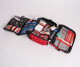 Open the Survival First Aid Survival Workplace First Aid Kit with various medical supplies, including bandages, scissors, gauze, and antiseptics, organized in a red and black water-resistant foldable case.