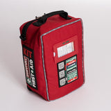 A red, water-resistant Survival Workplace First Aid Kit from Survival First Aid with various labels and information on the front, including sections on trauma, hydration, and utilities. The kit has a zipper, a black handle on top, and is compatible with the MOLLE system for easy attachment to gear.