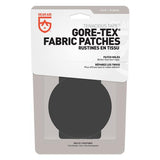 Packaging for the Gear Aid Gore-Tex Fabric Patches, featuring adhesive-backed patches and a sleek black design.