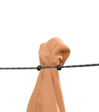 Beige fabric secured with an adjustable Sea to Summit Clothesline against a white background.