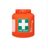 The Sea to Summit Lightweight First Aid Dry Bag is crafted from recycled 70D nylon with waterproof seams and features a prominent white cross and "FIRST AID KIT" on the front.
